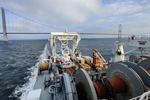 New pre-lay plough technology finishes first job for Kriegers Flak offshore wind farm Sailing Under The Great Belt Bridge